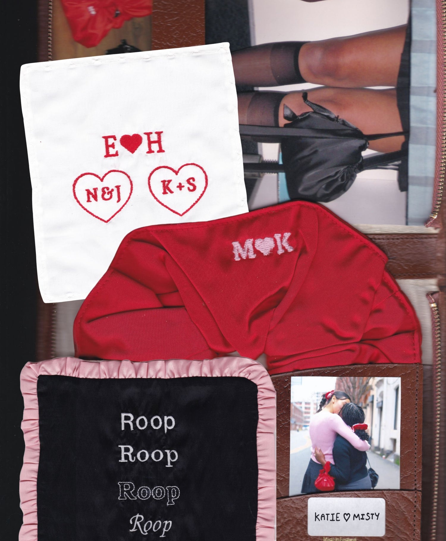 Red satin scrunchie with 'MK' embroidery in pink thread, white handkerchief with initials, and black fabric font sampler with pink ruffled boarder with text on an open brown leather wallet with photos inside