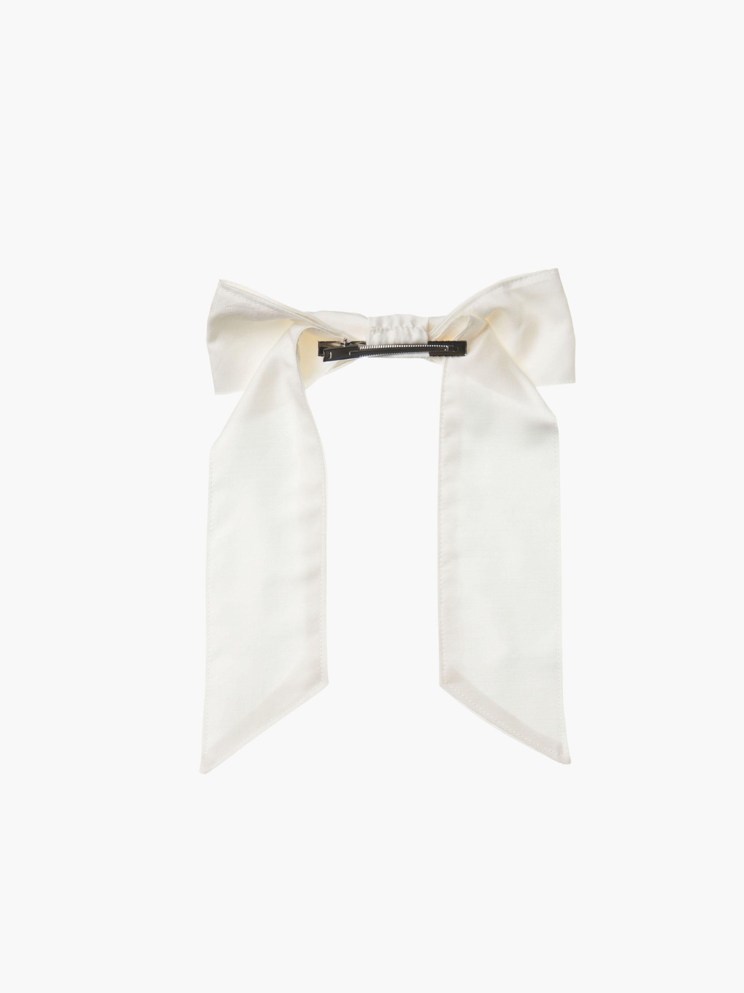 back view of an ivory bamboo silk satin hair bow clip with a silver crocodile clip on a white background
