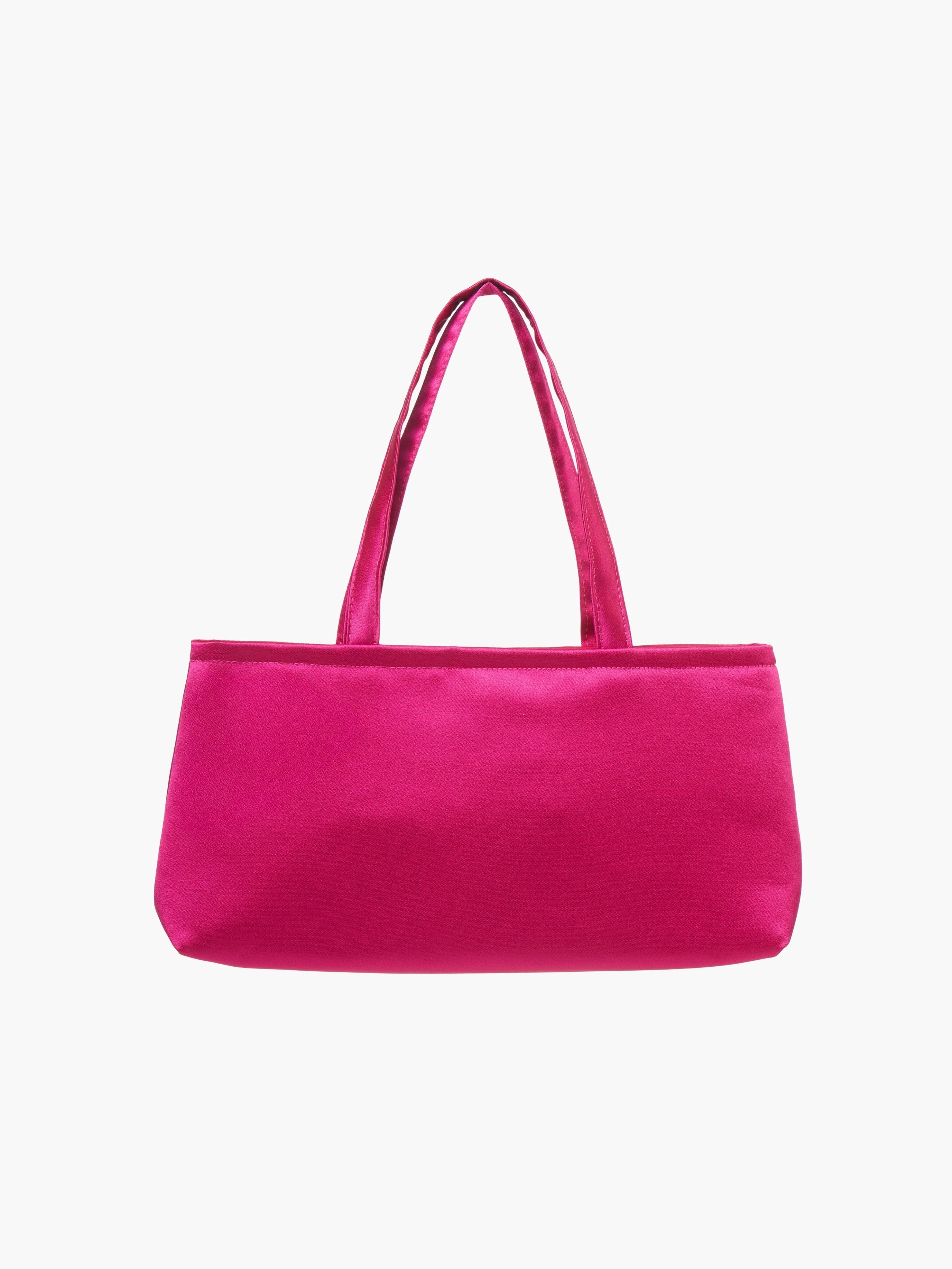 A rectangular fuschia handbag with double handles, made of silky fabric, is centered against a white background, conveying a simple and elegant style.