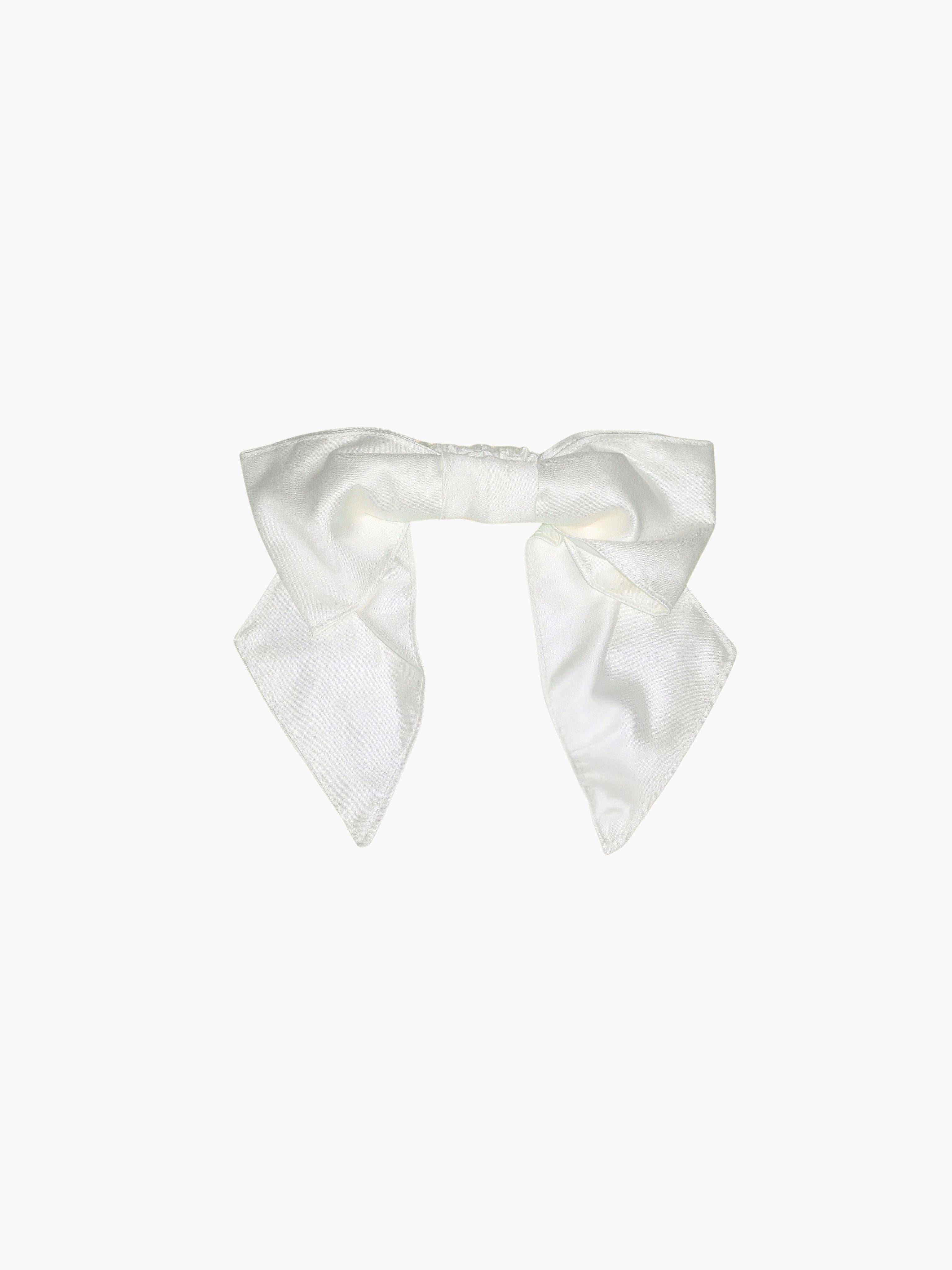 Ivory bamboo silk satin bridal hair bow scrunchie. Set on a white background.