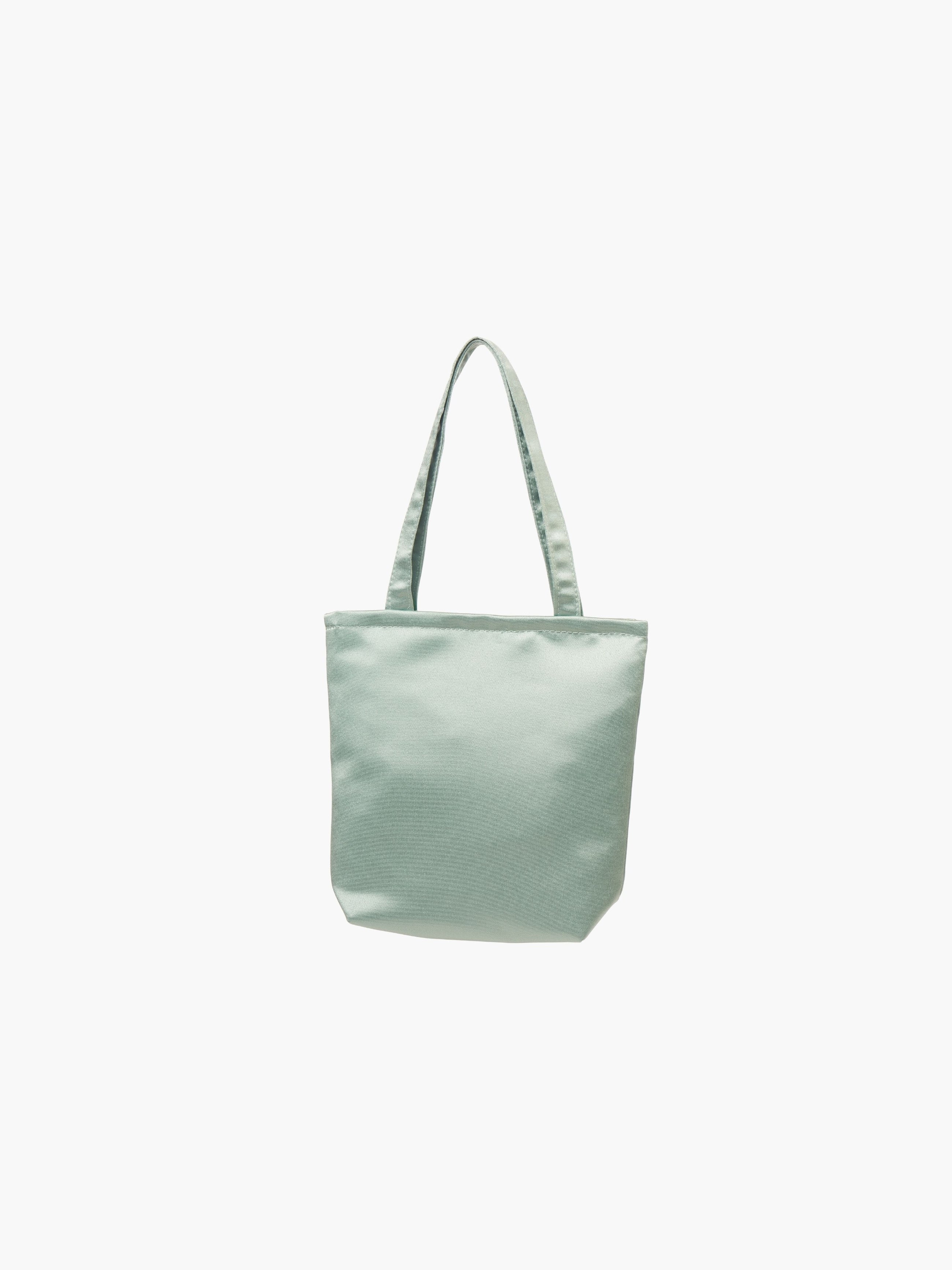 A sea green satin tote bag. It features matching handles, set against a plain white background.