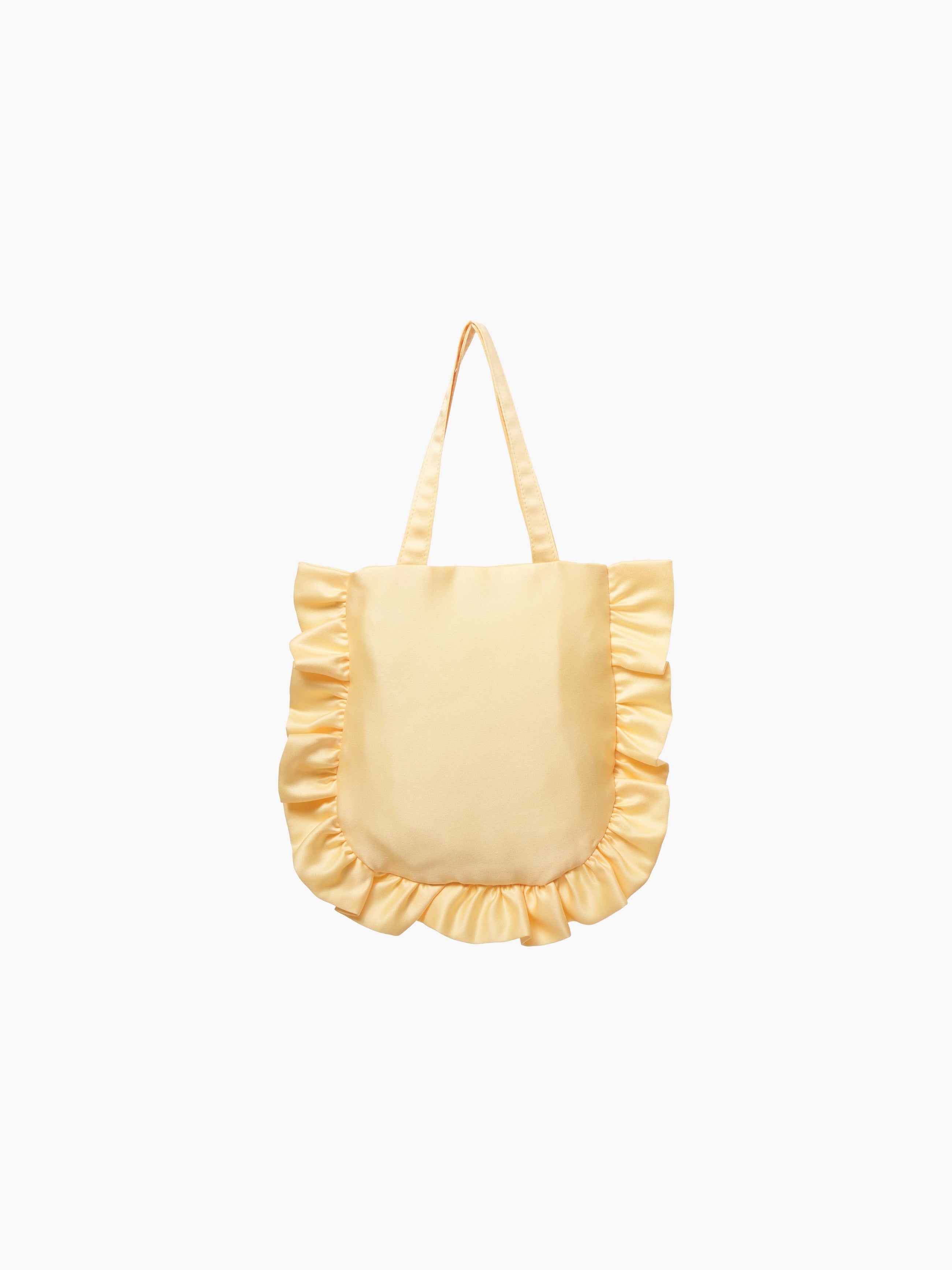 A yellow satin tote bag with ruffled edges on the sides and bottom. It features matching handles, set against a plain white background.