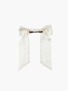 back view of an ivory bamboo silk satin hair bow clip with a silver crocodile clip on a white background