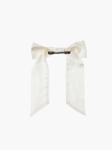 back view of an ivory bamboo silk satin hair bow clip with a silver crocodile clip on a white background