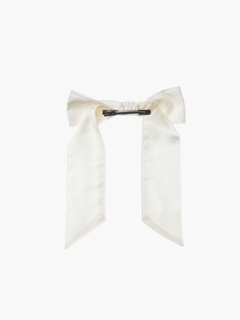 back view of an ivory bamboo silk satin hair bow clip with a silver crocodile clip on a white background