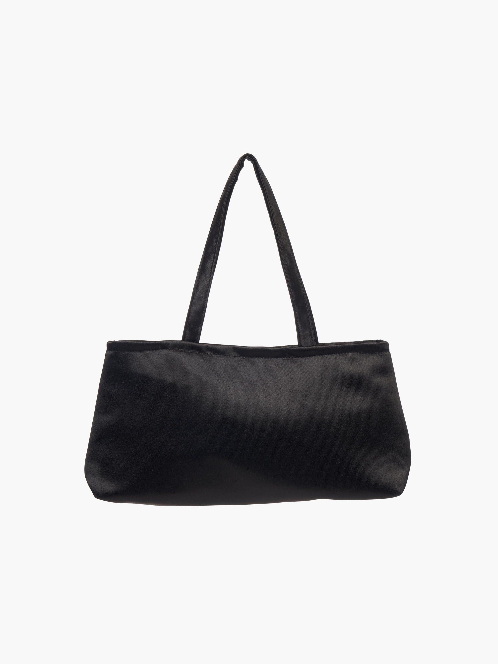 A sleek black handbag with a minimalist design, featuring a rectangular shape and two thin straps. The tone is elegant and versatile against a plain white background.