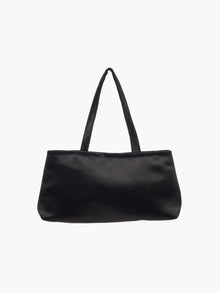 A sleek black handbag with a minimalist design, featuring a rectangular shape and two thin straps. The tone is elegant and versatile against a plain white background.