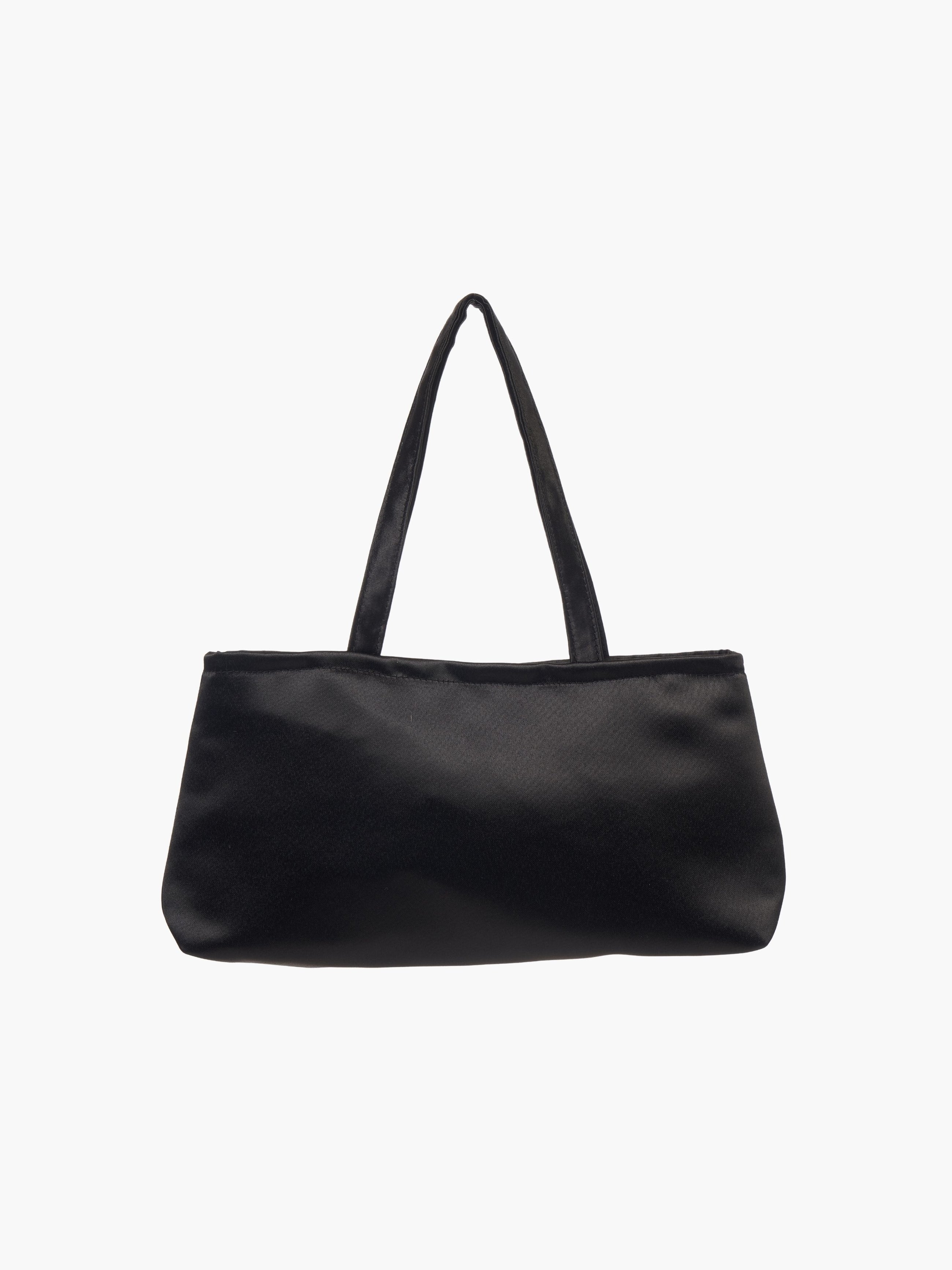 A sleek black handbag with a minimalist design, featuring a rectangular shape and two thin straps. The tone is elegant and versatile against a plain white background.