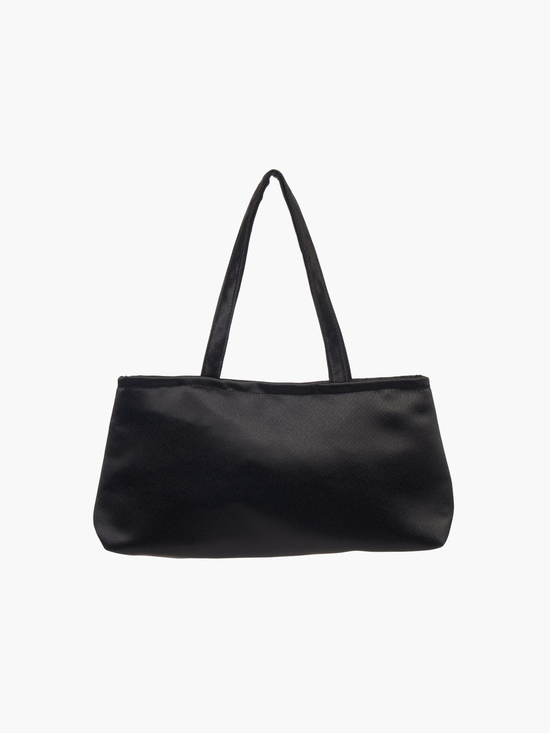 A sleek black handbag with a minimalist design, featuring a rectangular shape and two thin straps. The tone is elegant and versatile against a plain white background.