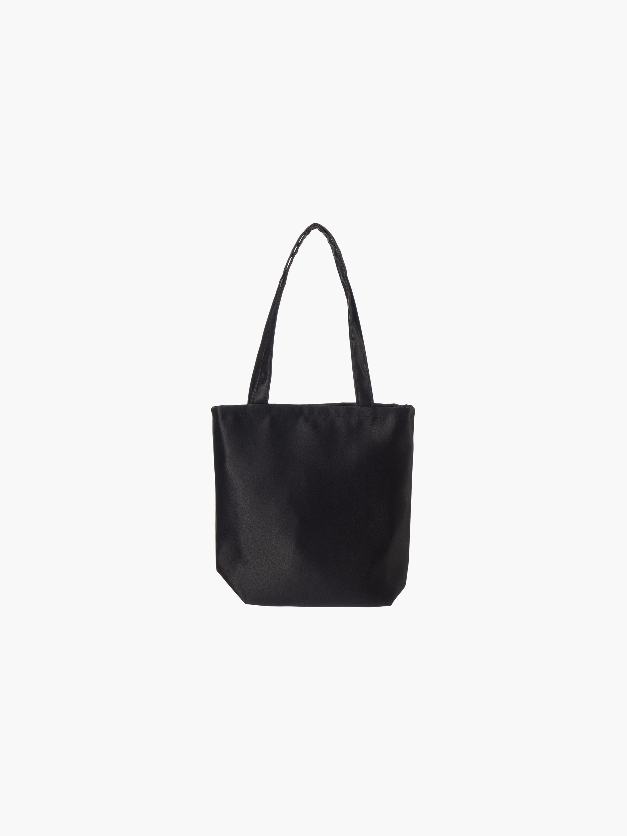 A black satin tote bag with. It features matching handles, set against a plain white background.