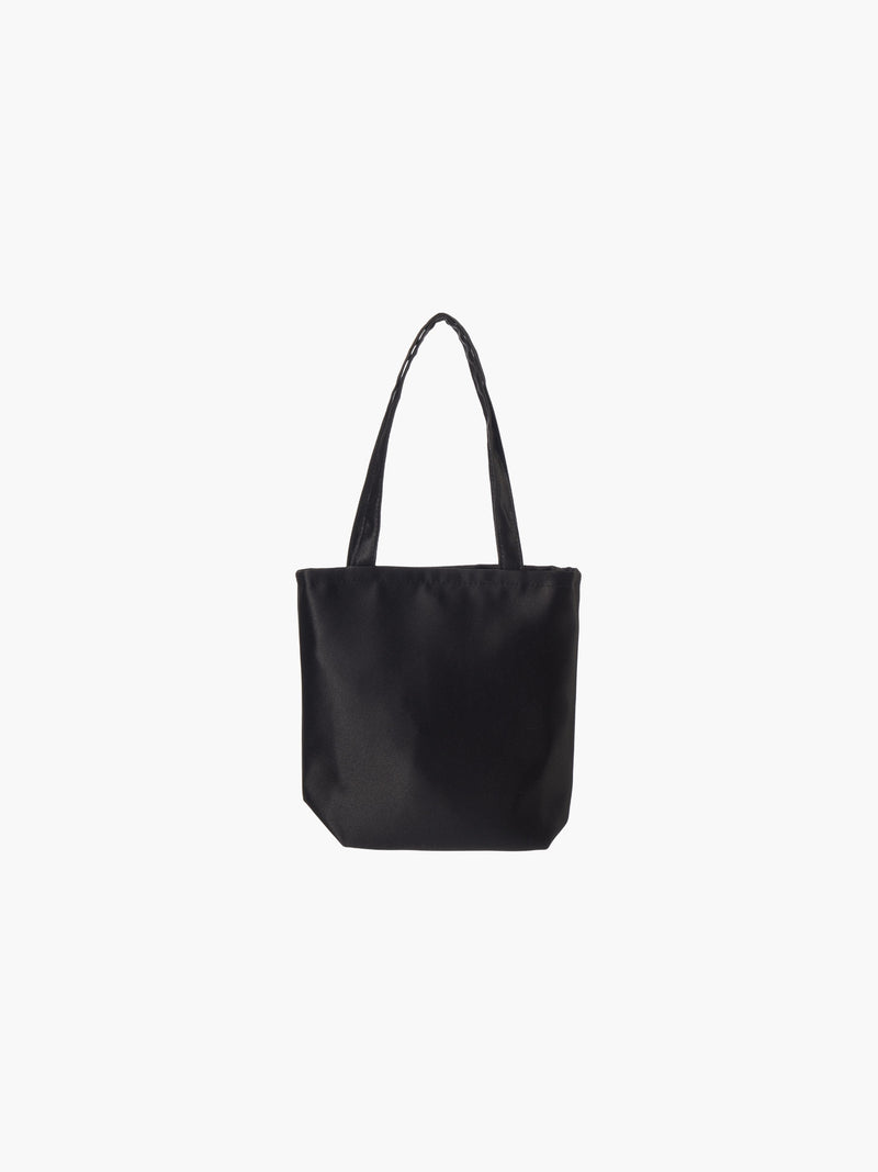 A black satin tote bag with. It features matching handles, set against a plain white background.