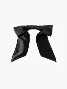 Black satin hair bow clip accessory on a white background