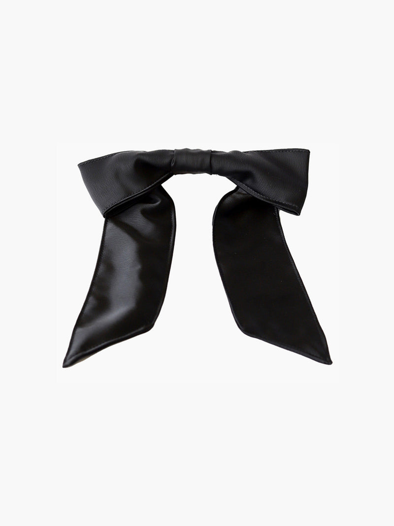 Black satin hair bow clip accessory on a white background