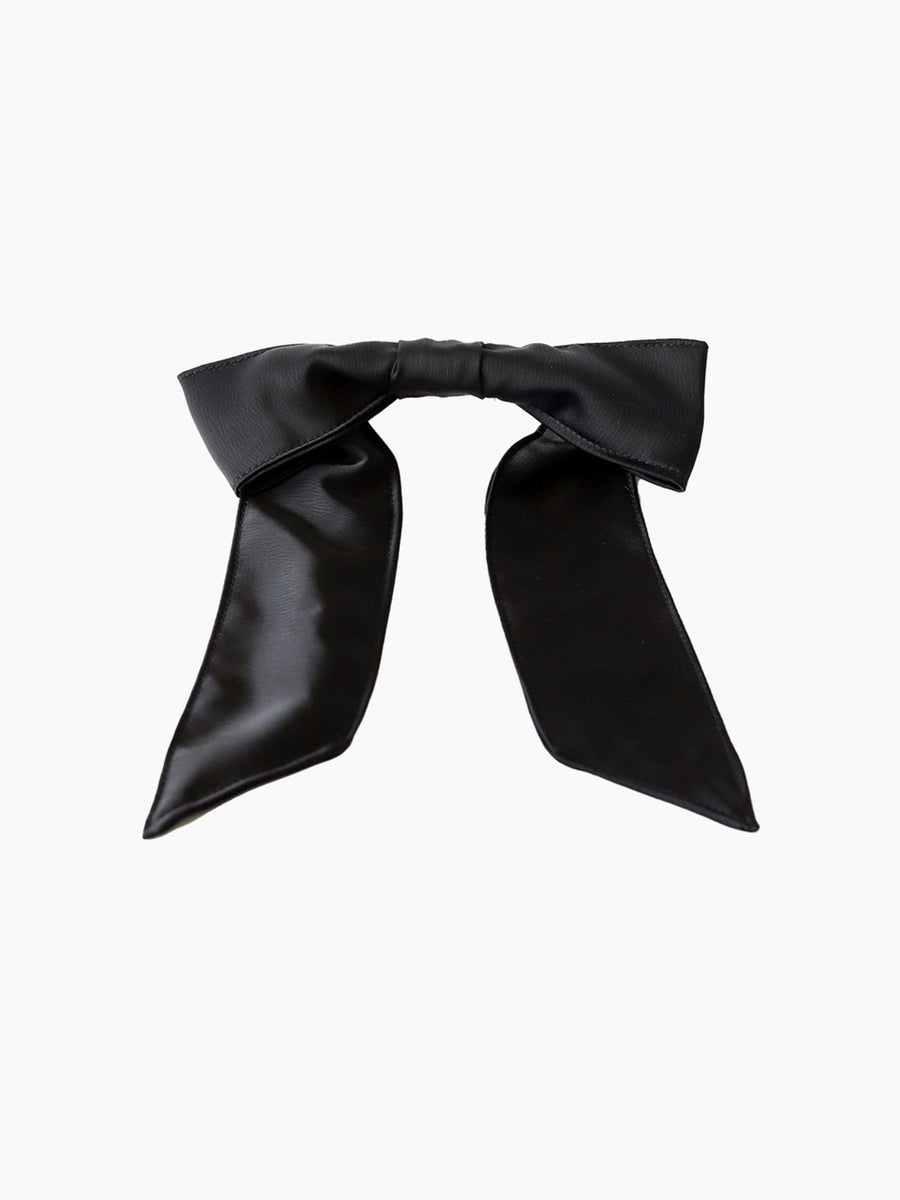 Black satin hair bow clip accessory on a white background