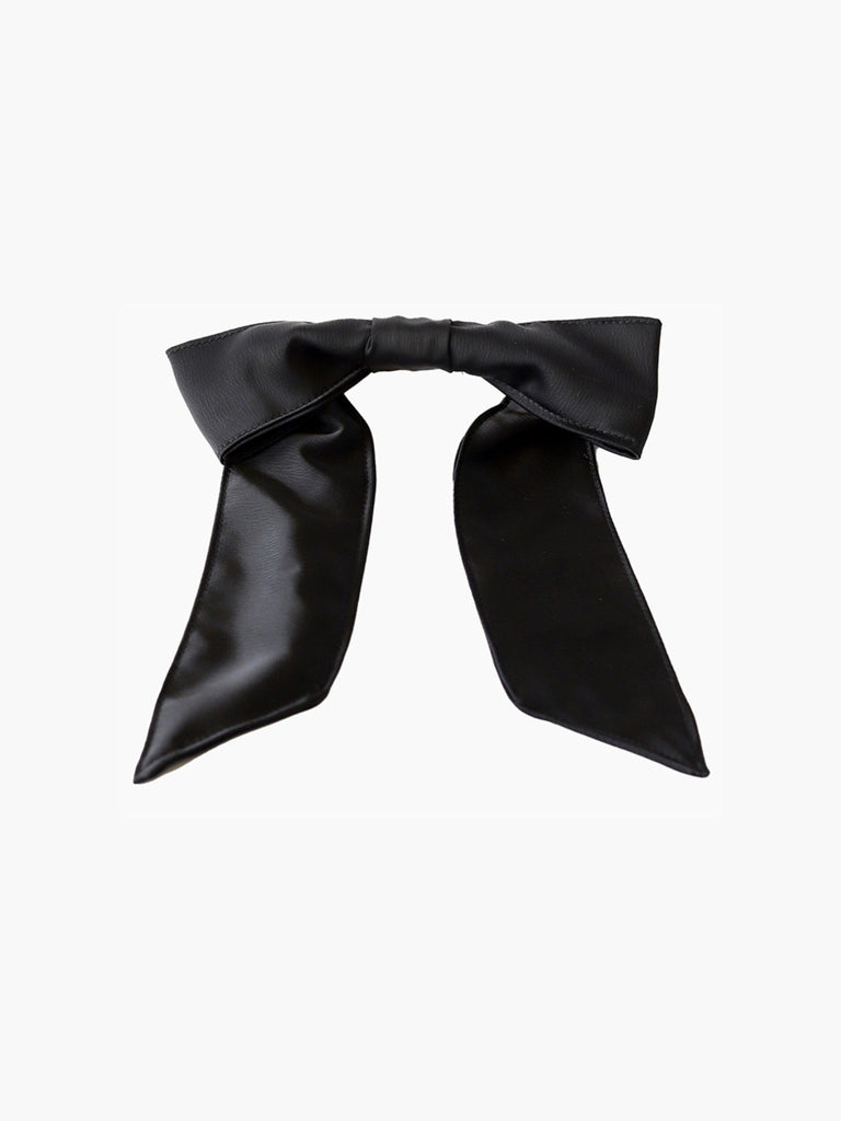 Black satin hair bow clip accessory on a white background
