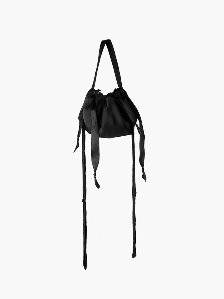 Black satin ribbon drawstring puffball bag with long straps, set on a white background