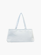 A baby blue satin baguette handbag with two handles. 