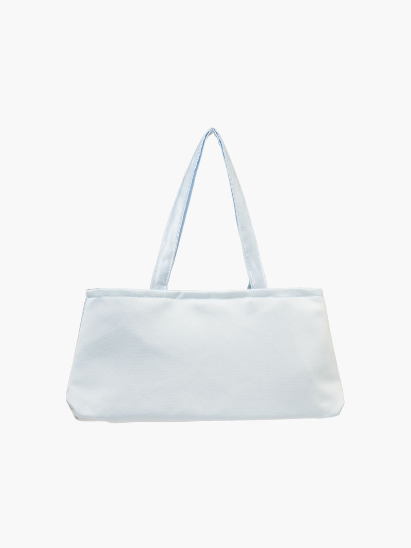 A baby blue satin baguette handbag with two handles. 