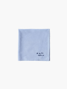 A blue cotton embroidered square handkerchief, embroidered with "all my love" in black.