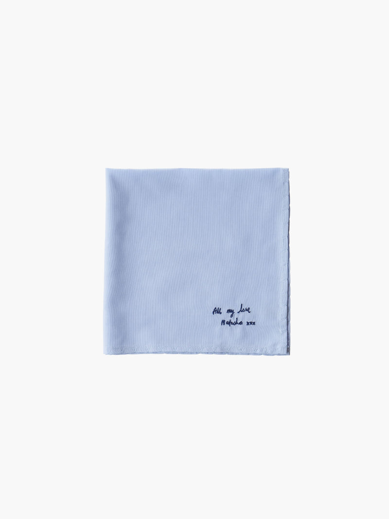 A blue cotton embroidered square handkerchief, embroidered with "all my love" in black.
