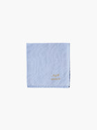 A blue cotton embroidered square handkerchief, embroidered with initials and the date in gold. 