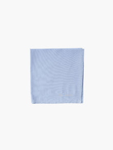 A blue cotton embroidered square handkerchief, embroidered with "The Joneses" in white. 