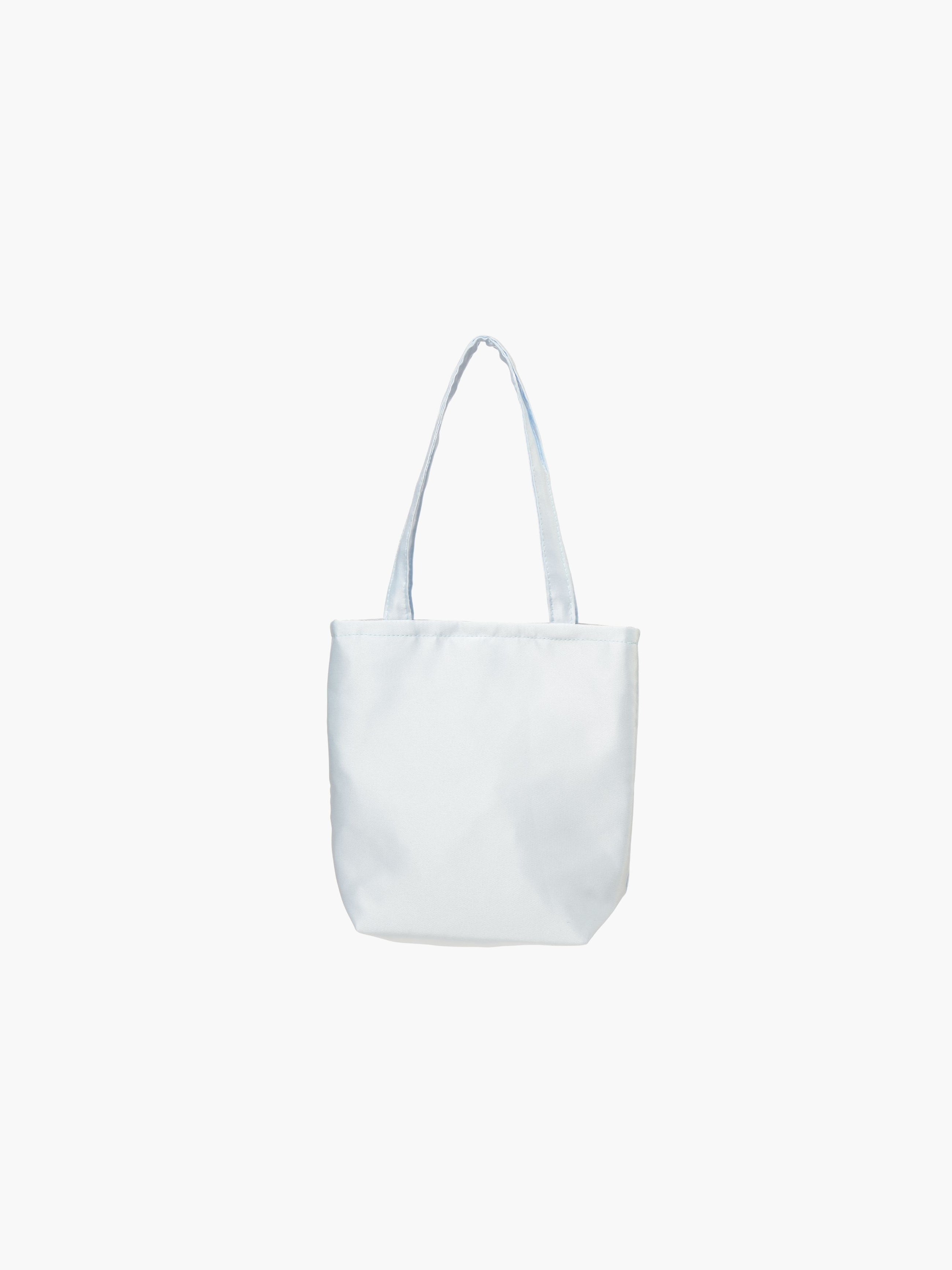 A light blue satin tote bag. It features matching handles, set against a plain white background.