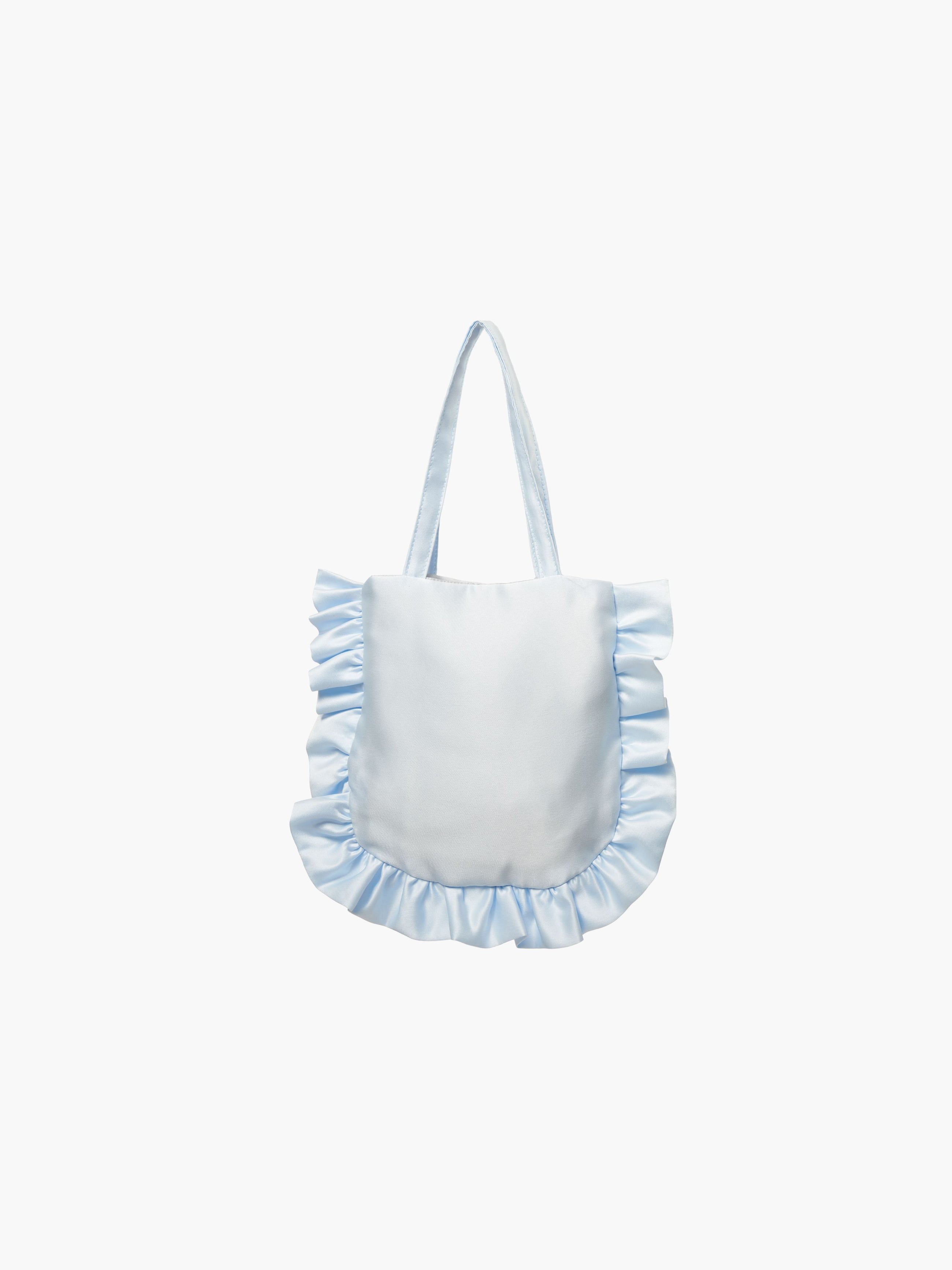 A light blue satin tote bag with ruffled edges on the sides and bottom. It features matching handles, set against a plain white background.