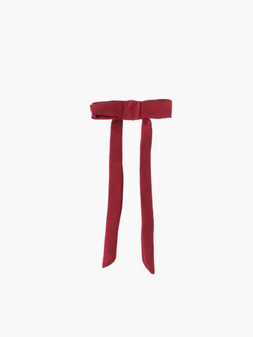 burgundy satin bow hair clip on a white background