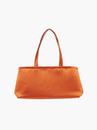 A rectangular orange handbag with double handles, made of silky fabric, is centered against a white background, conveying a simple and elegant style.