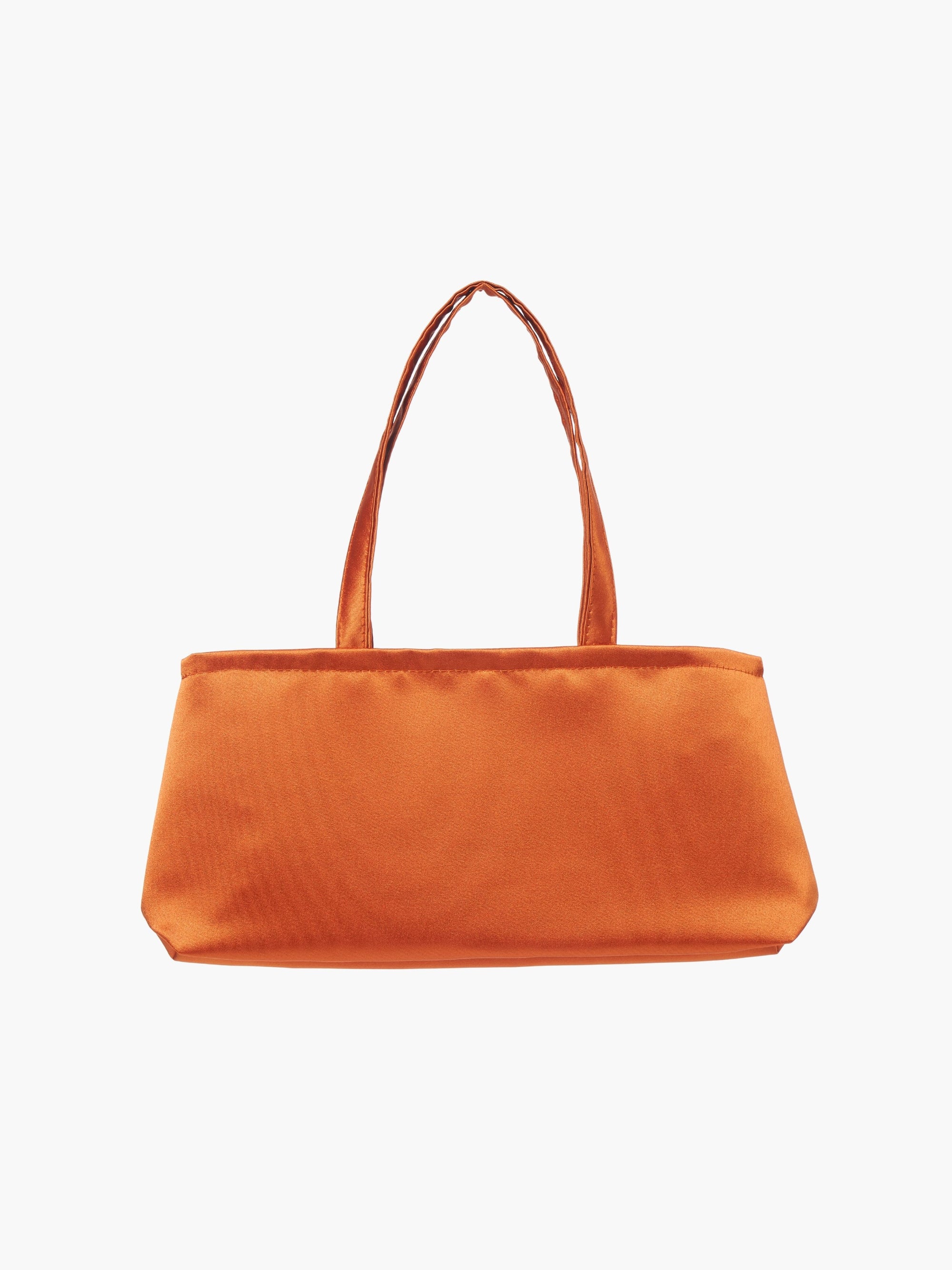 A rectangular orange handbag with double handles, made of silky fabric, is centered against a white background, conveying a simple and elegant style.
