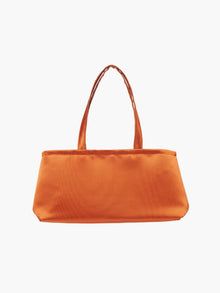 A rectangular orange handbag with double handles, made of silky fabric, is centered against a white background, conveying a simple and elegant style.