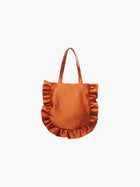 A burnt orange satin tote bag with ruffled edges on the sides and bottom. It features matching handles, set against a plain white background.