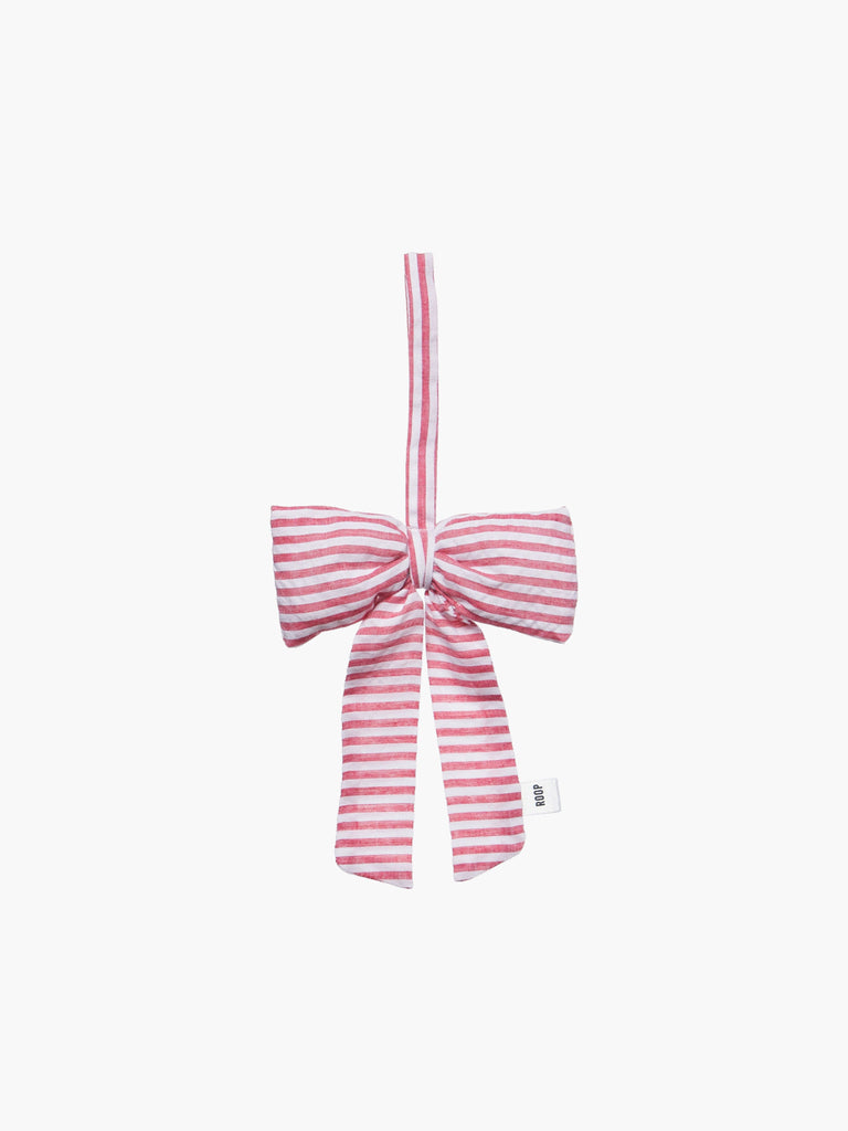 Red and white striped padded bow decoration on a white background