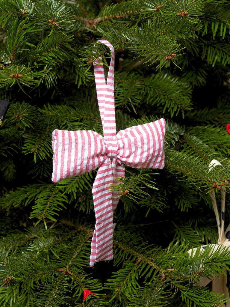Red and white striped bow decoration on a Christmas tree
