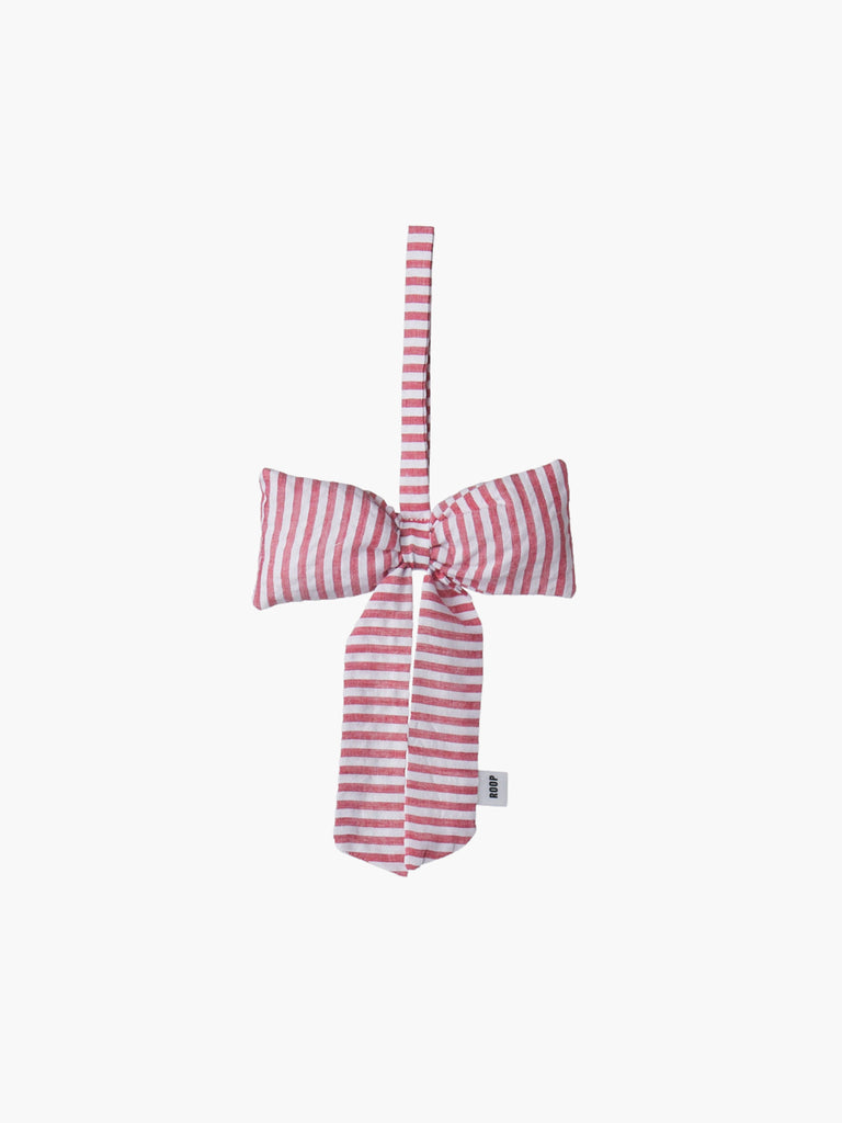A red and ivory white padded fabric bow featuring a loop for hanging. The bow exudes a playful and decorative feel.