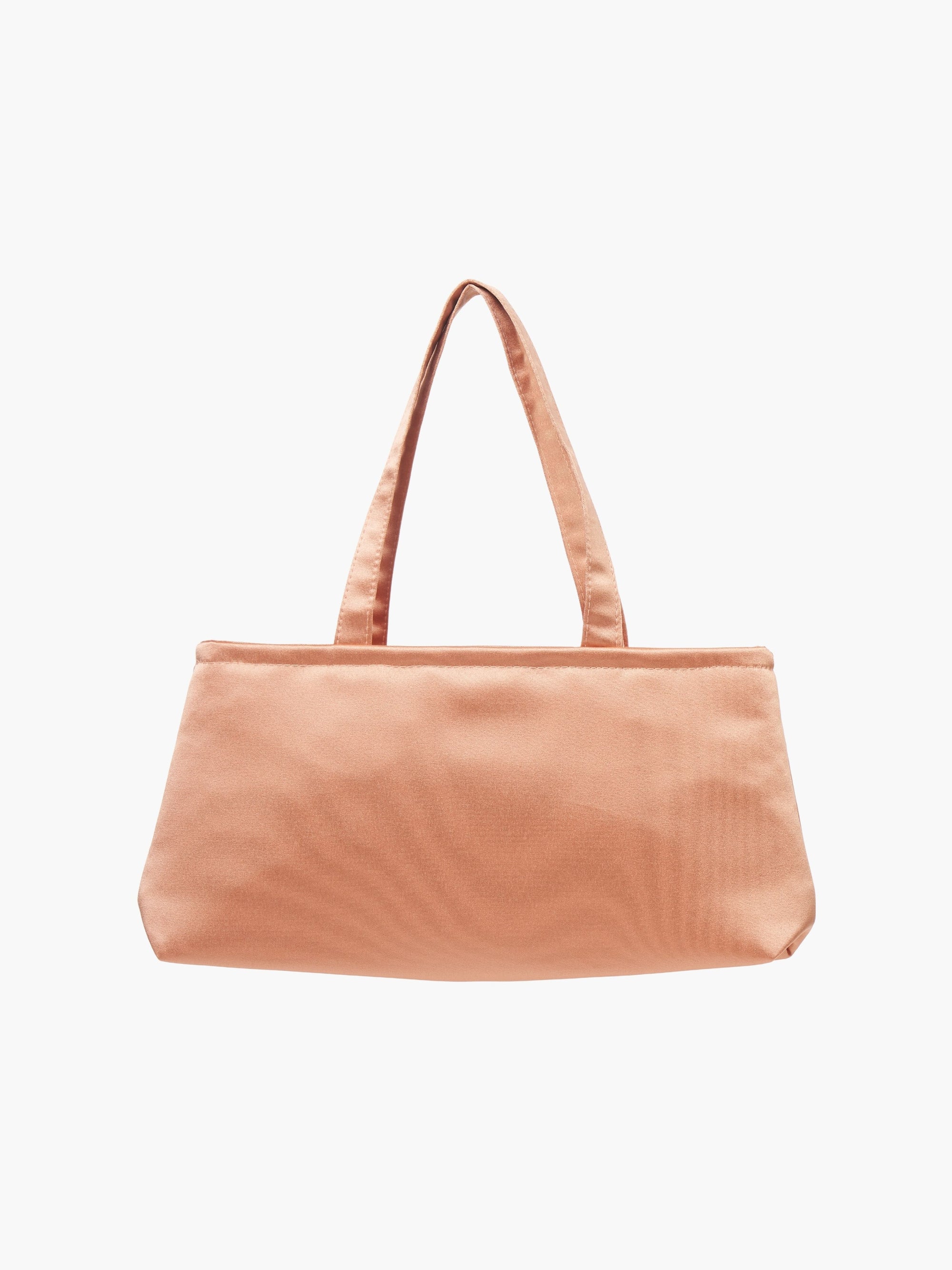 A sleek copper handbag with a minimalist design, featuring a rectangular shape and two thin straps. The tone is elegant and versatile against a plain white background.