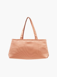 A sleek copper handbag with a minimalist design, featuring a rectangular shape and two thin straps. The tone is elegant and versatile against a plain white background.
