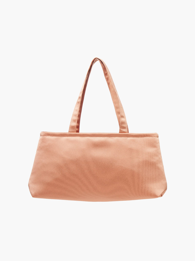 A sleek copper handbag with a minimalist design, featuring a rectangular shape and two thin straps. The tone is elegant and versatile against a plain white background.