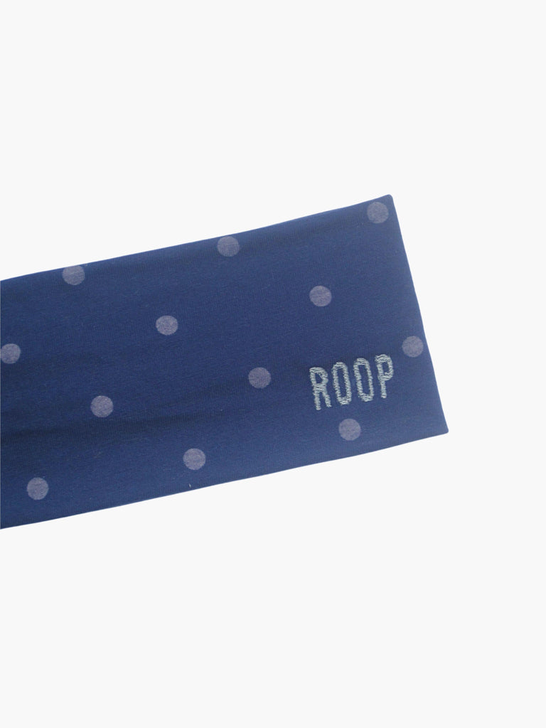Blue headband with light blue polka dots and 'ROOP' branding on a white background