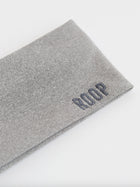 Grey stretch headband with 'ROOP' branding on a white background