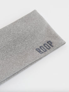 Grey stretch headband with 'ROOP' branding on a white background