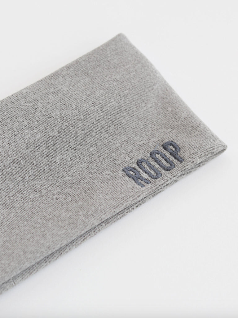 Grey stretch headband with 'ROOP' branding on a white background