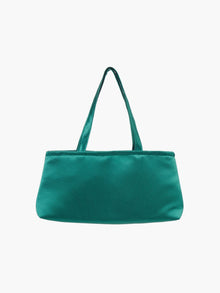 A sleek emerald green handbag with a minimalist design, featuring a rectangular shape and two thin straps. The tone is elegant and versatile against a plain white background.