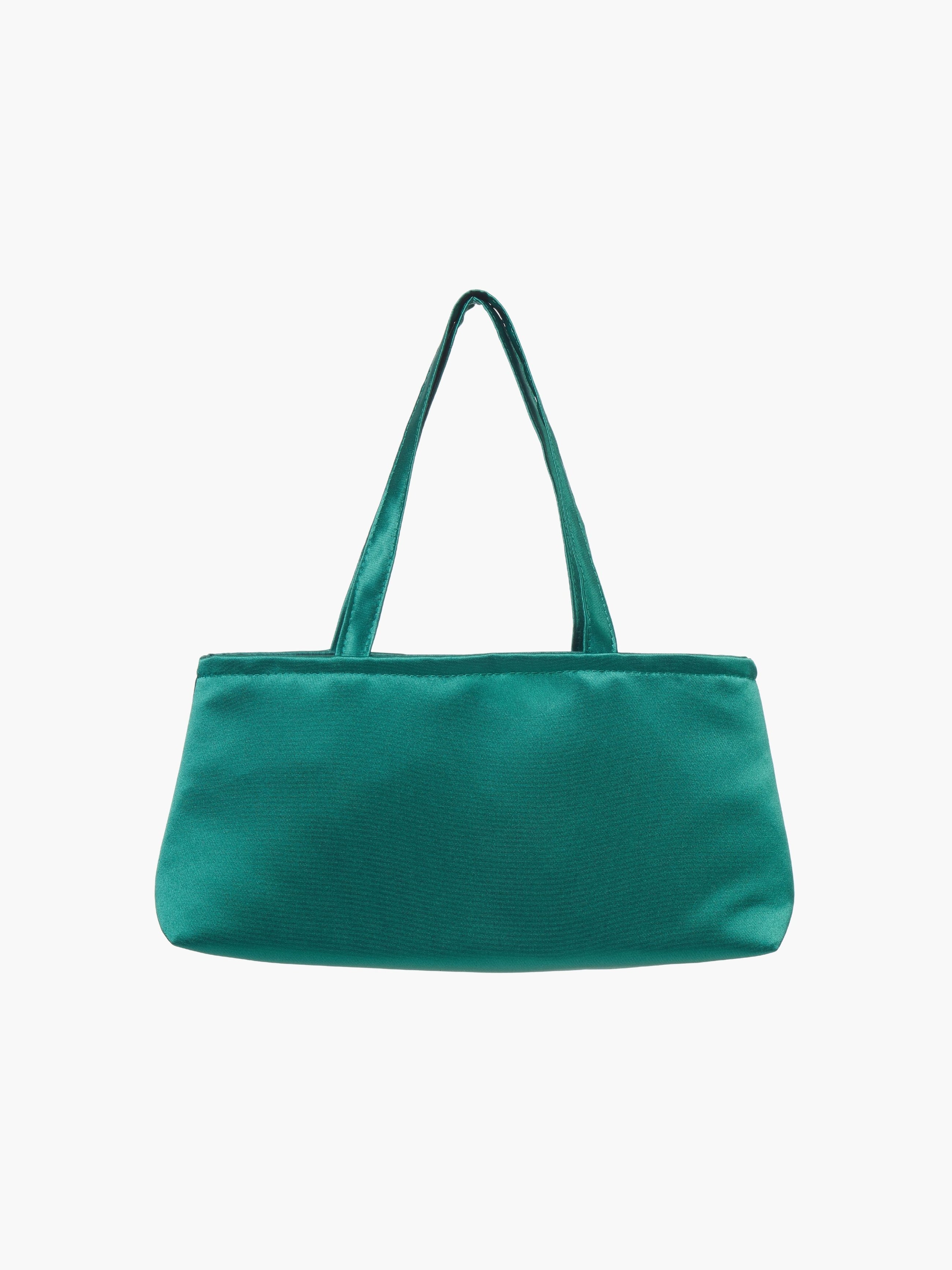 A sleek emerald green handbag with a minimalist design, featuring a rectangular shape and two thin straps. The tone is elegant and versatile against a plain white background.