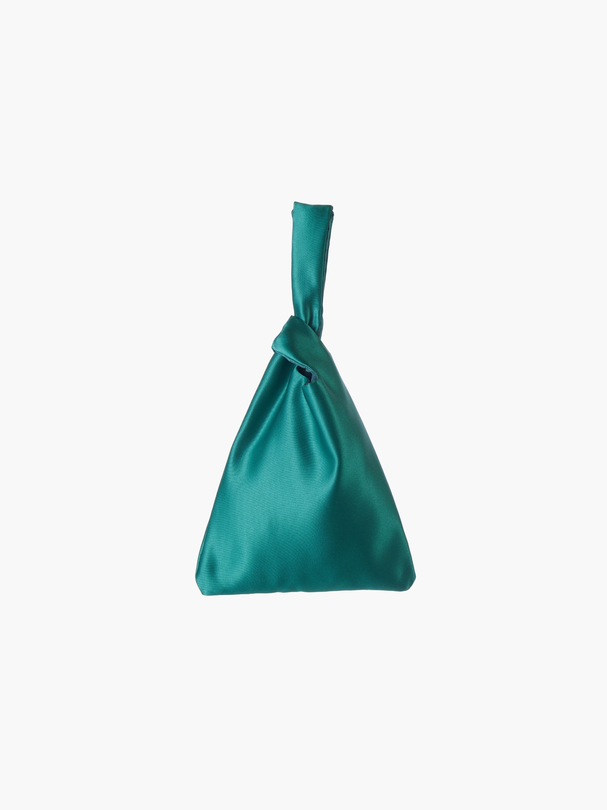 Emerald satin knot bag against a plain white background. The elegant bag has a twisted handle and sleek, glossy fabric, exuding a chic, minimalist style.