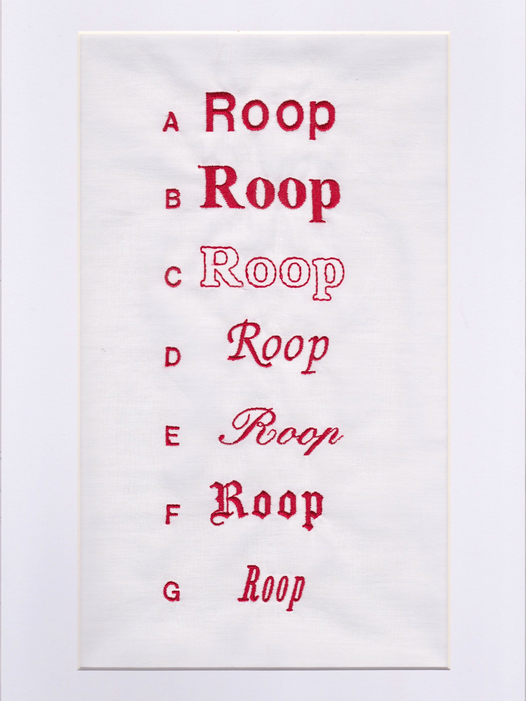 Sample chart of red embroidered fonts. A-G list of ROOP embroidered in different fonts. On a white background.