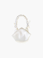 Ivory satin ruched handle handbag with decorative bows, set on a white background