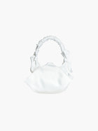 white satin ruched handle handbag with decorative bows, set on a white background