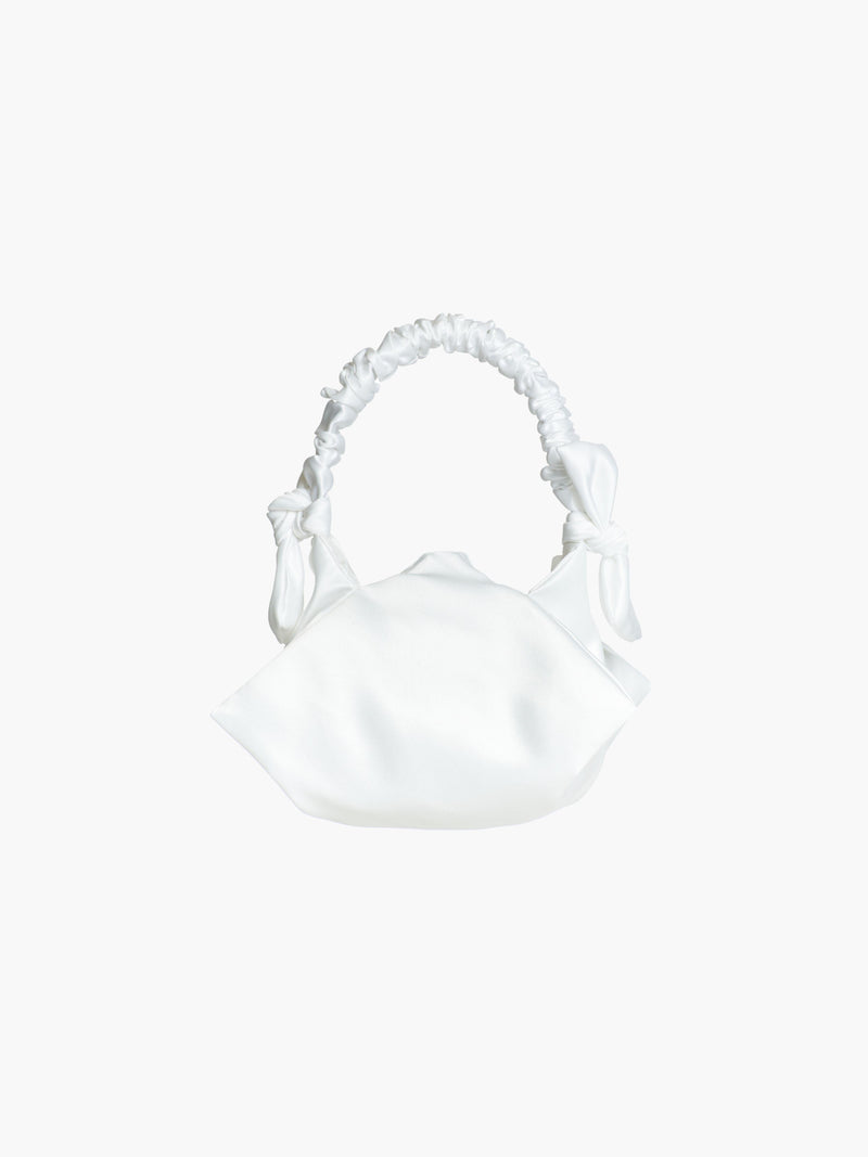 white satin ruched handle handbag with decorative bows, set on a white background